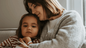 foster mother holding child
