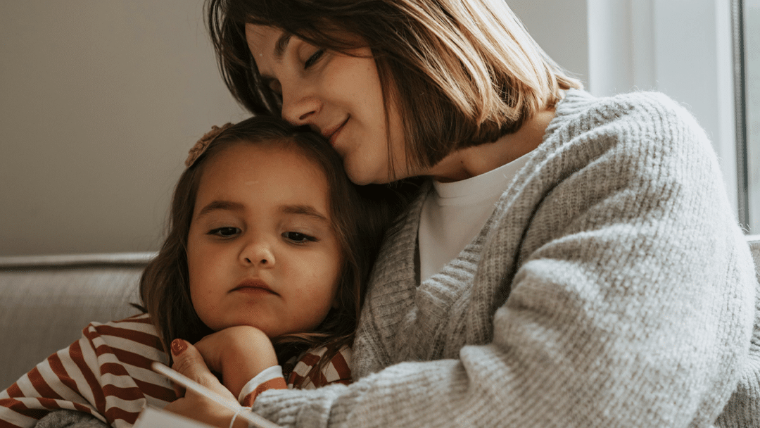 foster mother holding child